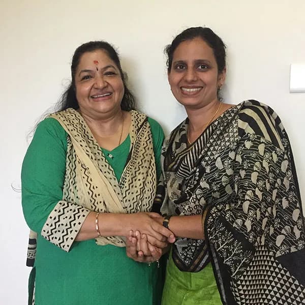 K. S. Chithra with a member of the ALAN T21 team