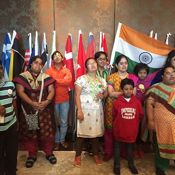 Families and delegates with the Indian flag