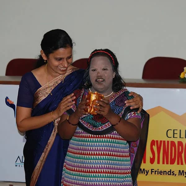 A young woman receives an award