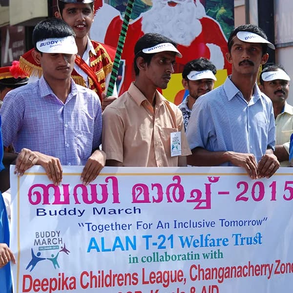 Participants holding the Buddy March 2015 banner