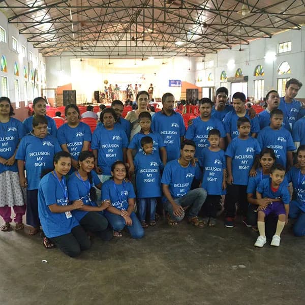 Children in matching blue T-shirts at an ALAN T21 celebration