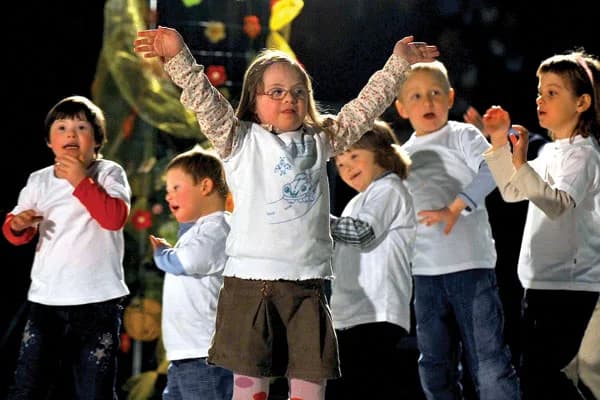 Children dancing together on stage